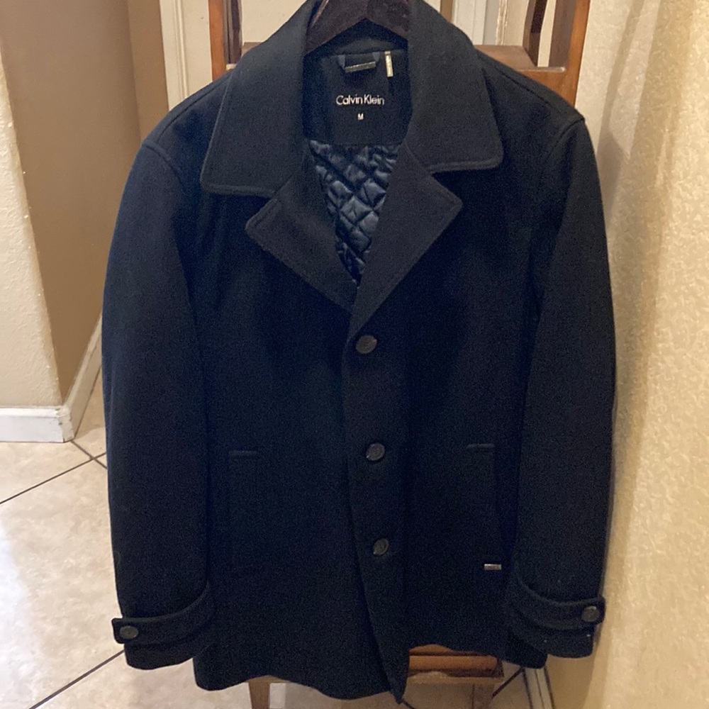 Brand new navy Calvin Kline trench jacket size medium. Never been worn